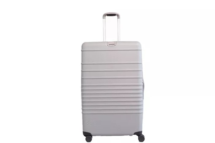 Level8 Voyageur 28 handle extended, being rolled through an airport corridor