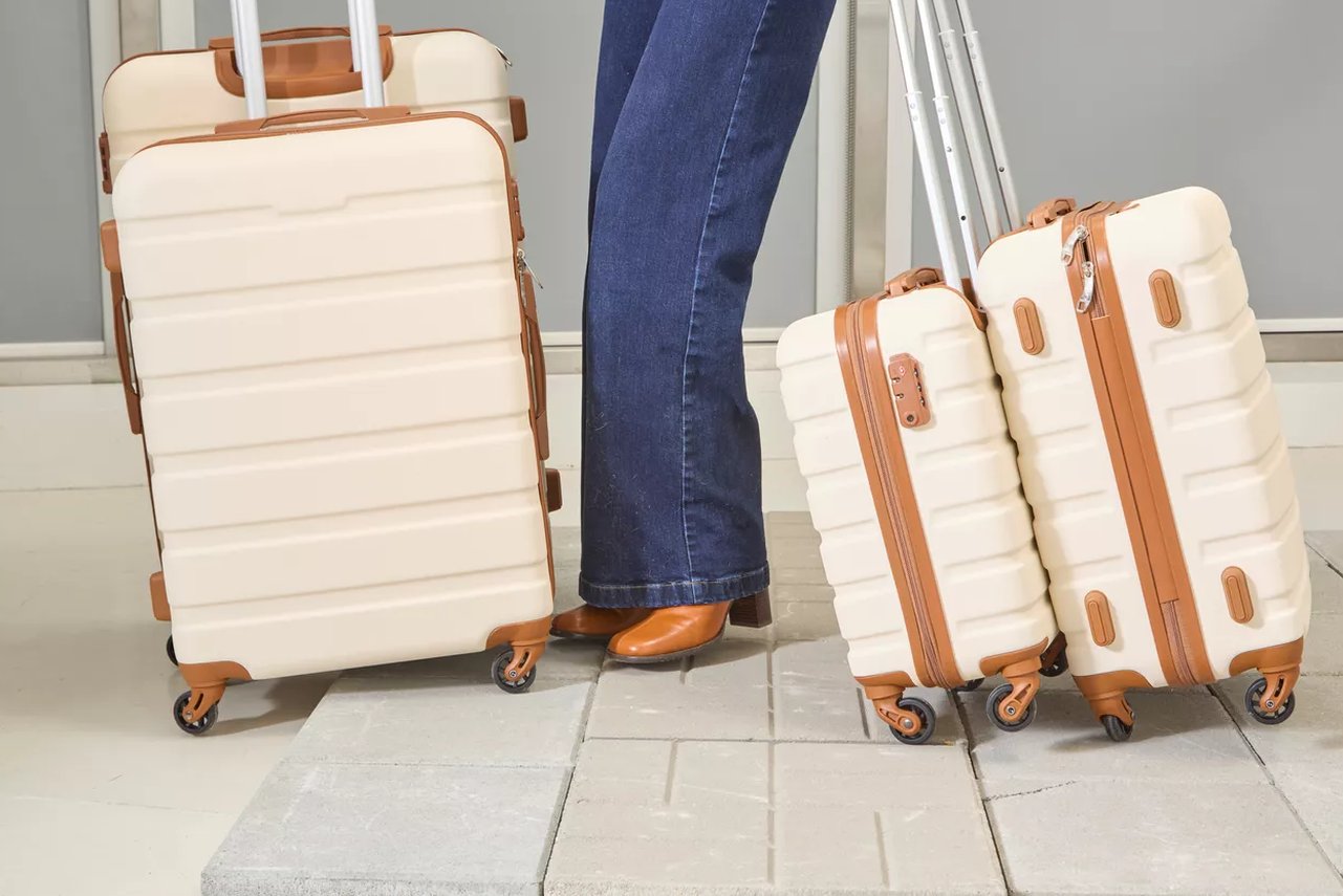Level8 carry-on next to an airline gate-size checker frame